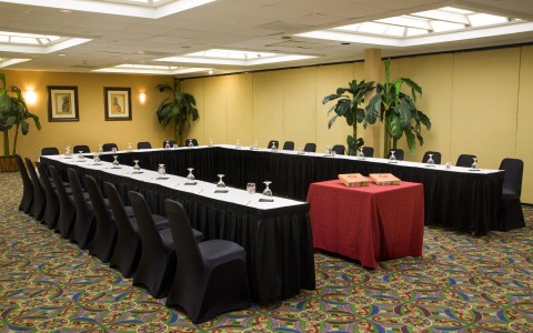 Meeting room with podium & tables set in U shaped fashion