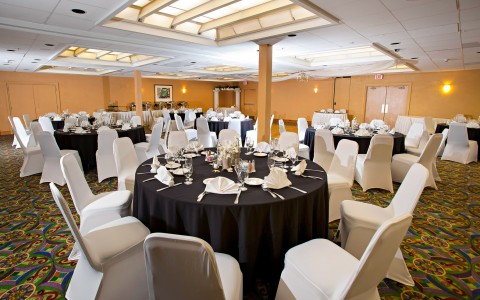 Event space with round tables set for meal 